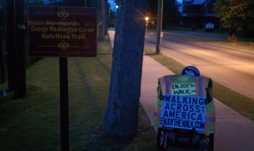 Yesterday's 16-mile walk included the George Washington Carver Nutrition Trail-- a sidewalk stroll replete with instructive signs for healthy living. (Inspiring!) After yesterday's early start, having finished before it grew too blisteringly hot, I'd planned a similar early departure for today. A surprise AM storm cell has altered those plans. It's supposed to clear up this afternoon, but I'm supposed to meet a local family for a dinner then. I'm hungry for more miles today, and I'm confident that I'll earn at least some-- I just have to figure out how/when...