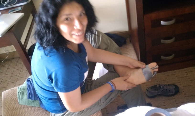 Gearing up for 20k on the road today, Rocio duct tapes her feet to prevent blisters in the most vulnerable places. 